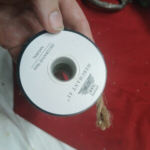 roll of Merchant 41  natural jute decorative trim, 1 roll and a half
